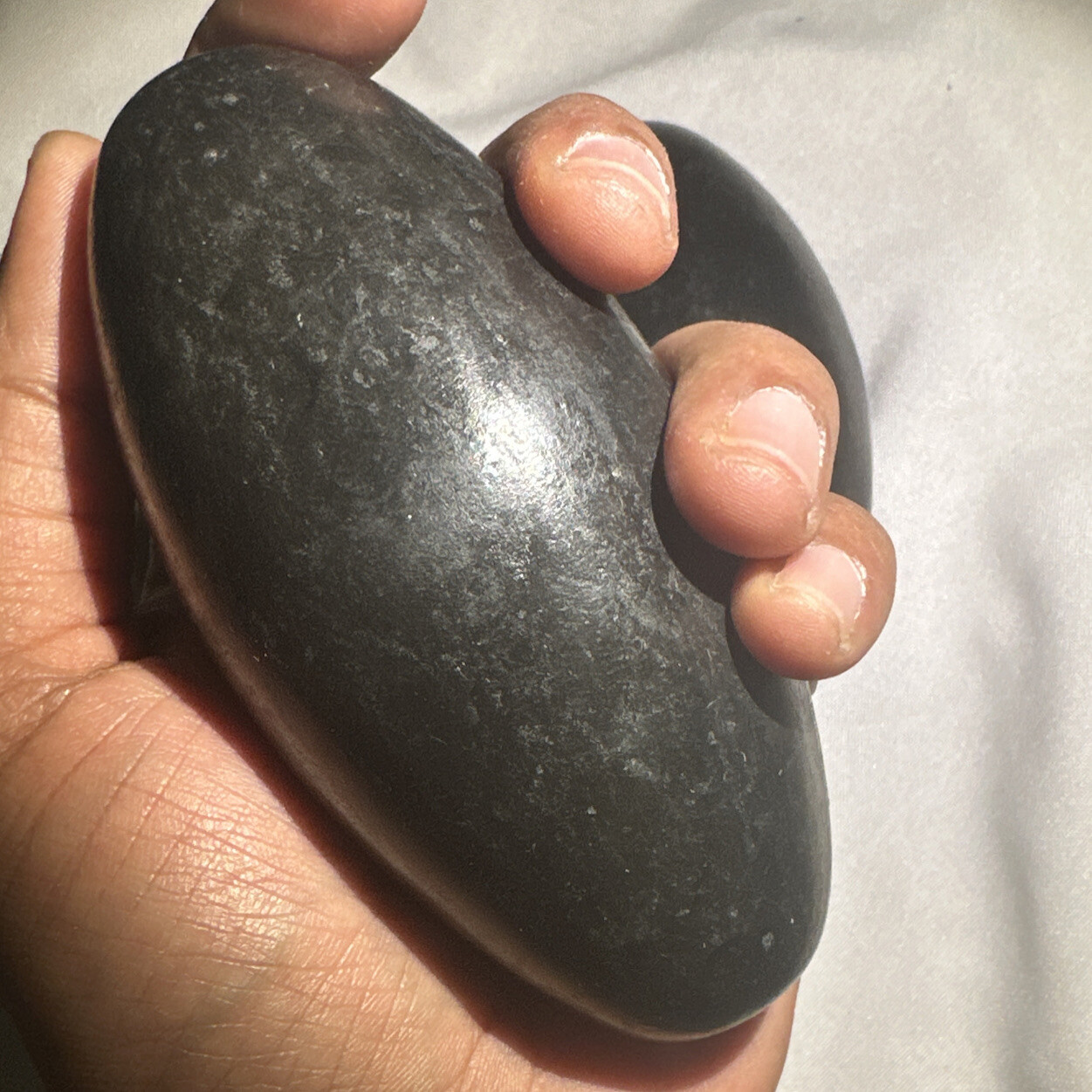 4” Black Shiva Lingam stone from Narmada River, India – Palm size Shiva – 1 pc